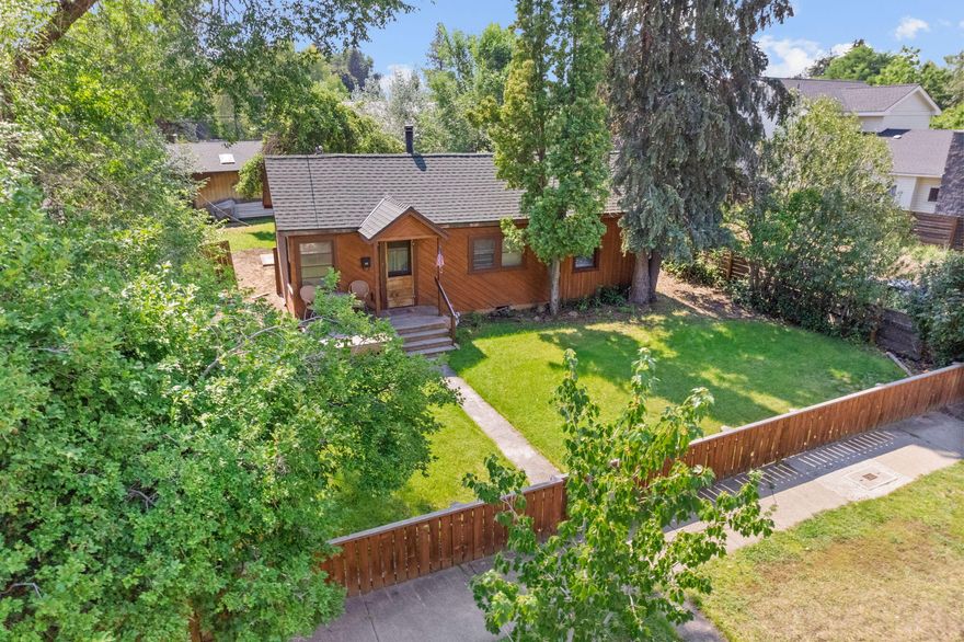 This 1967 home featuring 2 beds, 1 bath, 924 sq ft and a detached garage, sits on TWO RM Medium-Density Zoned Tax Lots on BEND'S WESTSIDE! With NO CC&Rs or HOA, this double lot with alley access is .16 acres (6,970 sq ft)- a prime canvas for your custom dream home or multi-family development. Ideally located between NW Newport Ave and NW Portland Ave, this location offers the perfect blend of quiet and convenience. Just a short walk to downtown Bend, it's only 2 blocks from the Deschutes River and Drake Park- perfect for river floats followed by a short stroll home! Enjoy close proximity to several magnet schools, Central Oregon Community College, Newport Market, the Galveston Corridor, Harmon and Columbia Park. Walk or bike to Hayden Homes Amphitheater, and everything else Bend's vibrant Westside has to offer. Opportunities like this with larger lots on the Westside are rare. Don't miss this chance to bring your vision to life!