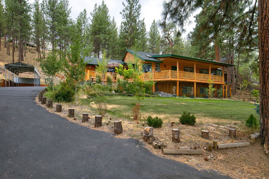 This home has it all including four bedrooms (primary bedroom on main level), two full bathrooms, light and bright kitchen open to the dining/living room with propane wood stove, laundry room with sink and attached two car garage for all your friends and family. Property fronts the Camp Polk Meadow Preserve and sits on just under one acre. Close proximity to downtown Sisters and Aspen Lakes Golf Course makes this one of Sisters' best buys!