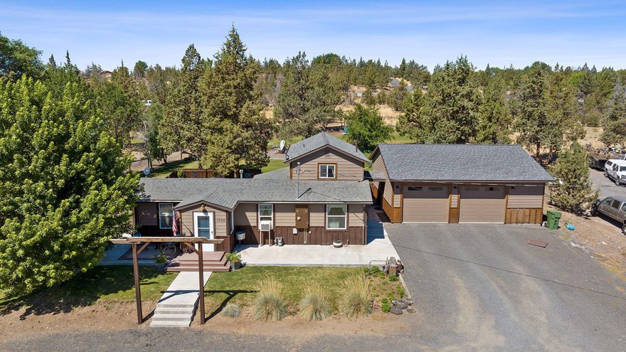 Completely remodeled down to the studs with updated plumbing and insulation throughout. This charming 2-bedroom, 1 bath home sits on 2.76 acres and blends modern updates with serene country living. Enjoy a spacious kitchen filled with natural light, tile flooring, and stylish backsplash. The large back deck features a hot tub and space to entertain or unwind. Detached oversized garage is fully finished with heating and cooling—perfect for a shop, gym, or extra storage. Landscaped yard, mature trees, a separate shed, and plenty of space to grow. Peaceful setting just minutes from town. 
Buyer to due diligence on partitioning, Subdividing or ADU. See Private comments.