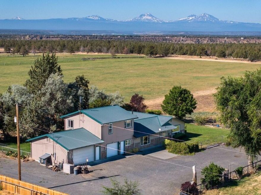 Outstanding Cascade Mountain views and a spacious 4 bed, 4 bath home on 35.48 acres with 35 acres of North Unit Irrigation just 10 min to Terrebonne and 15 min to Redmond. Main level living features a great room, dining room, 3 bedrooms, 3 baths, large utility room & office. Upstairs offers a private primary suite and a additional office. Two 26' deep attached garages (one insulated/heated). Enjoy the fenced back yard with a large patio plus there is a fenced garden area. The house has a new HVAC system plus solar panels and a backup generator. Good outbuildings including a 108'x42' barn with 5 stalls, a feed alley & a large insulated tack room, a 48'x36' barn and a 48'x18'equipment shed. Fully fenced and a nice set-up for livestock with auto water tanks & numerous water hydrants. Wheel lines make this easy to irrigate. Main field will be planted in mixed grass 9/2025.