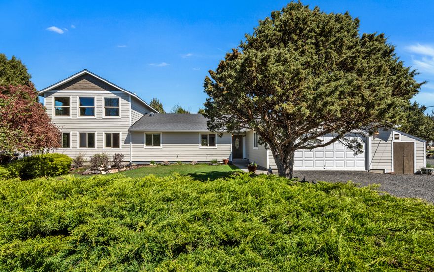 Situated on 2.51 acres, this 3-bed, 3-bath residence offers a peaceful setting and a versatile floor plan.  This 2336 sq ft home features two primary bedrooms suites, new siding and windows throughout. Great separation throughout the home makes it perfect for guests or multi generational living. Large main level bonus room that can easily serve as theater, or game room. Outdoor living is a highlight, with a spacious deck, gazebo, and water feature that create an inviting atmosphere. A separate 48' x 36' shop offers ample space for projects, storage, or hobbies, with plenty of room for tools, equipment, or additional vehicles. The fully fenced property includes mature landscaping, greenhouse, chicken coop, and covered RV parking with ample storage. Private gated entry that offers both security and a sense of arrival. Move in ready- with a quiet and serene setting that should appeal to many. Make your appointment today.