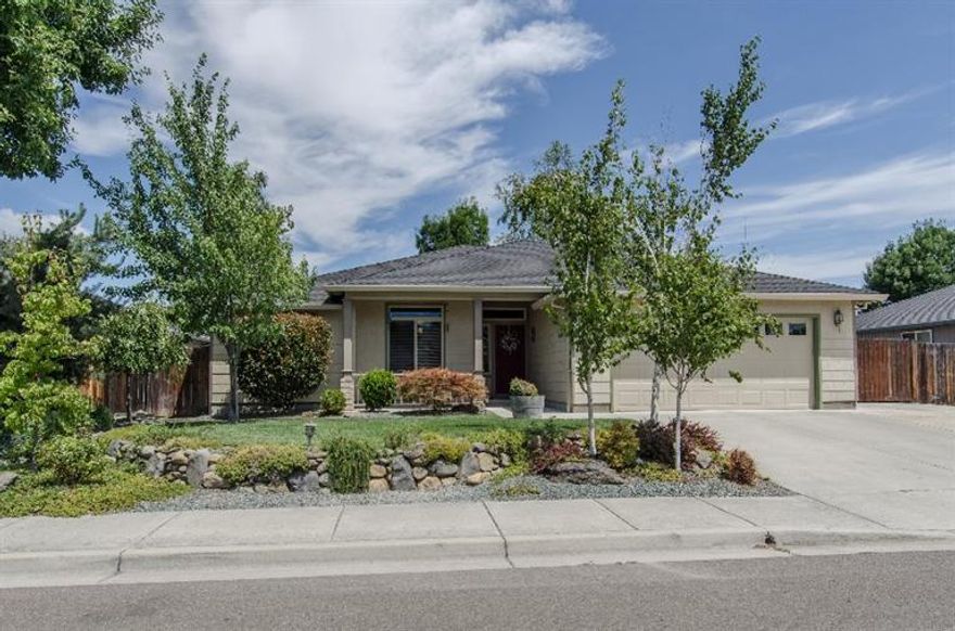 Pride of Ownership is evident in this extremely well maintained 1958 sq ft home, with beautifully landscaped front and back yards (all plants are on drip watering for easier maintenance). Highly sought after split floor plan with guest bedrooms on one side and the roomy master suite with private bath and walk-in closet on the other. One bedroom, with French doors, is currently being utilized as an office. However, there are 4 bedrooms total! The oak floor entry leads to the spacious living room with gas fireplace overlooked by the dining and kitchen areas. What a nice kitchen! Very roomy with lots of cabinetry and counter space as well as an island breakfast bar. You can prepare meals and still be part of the family activities or keep an eye on the kids in the backyard. The dining area has a door leading to the backyard and covered patio--perfect for those summer barbecues. Extra wide concrete driveway leads to RV parking behind gate. Call NOW for appointment!