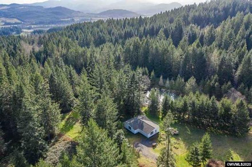 This 75.40 acres provides a place for serene privacy with pasture, beautifully wooded grounds, ponds, creeks, and a view to take your breath away. There is some harvestable timber and numerous locations for hunting blinds, elk, deer & turkey. Long gravel driveway to a well kept, newer single story home with a 2 car garage. Come see for yourself!