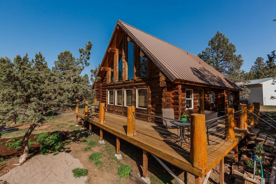 Beautiful handcrafted Oregon log home on small acreage close to town in a great NW Redmond Location. This 3 bedroom, 2 bath, 1,667 sq ft. on 2.45 acres with large shop, chicken coop, greenhouse, and garden shed. Plenty of room to park you RV or any other toys. New carpet installed in May of 2019. Come enjoy the peace and quiet. Perfect for all your animals. Miles of trails close by for your enjoyment. This is a must see.