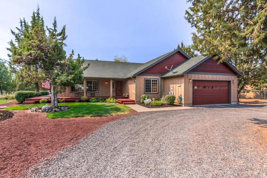 Beautiful custom craftsman home on 1 acre. Open concept, single-level living with vaulted ceilings, central AC, and a propane fireplace. This home has a smart thermostat for convenience, kitchen island/breakfast bar with cabinet pullouts, lazy susans, stainless steel appliances, and under & over counter lighting. The spacious master bedroom has an en-suite with a large walk-in closet with built-in shelving. The attached 2 car garage has a utility sink. Fantastic detached 1,320 s.f. garage/shop! This shop has 2 car bays, tons of storage, and 2 finished & heated rooms that could be used as office space or hobby areas. Next to the shop is RV parking with 30 amp hookups. The home has approximately 800 s.f. of newly stained deck that wraps around the home and overlooks the beautiful garden with raised beds and an irrigation system. Plus, all the Crooked River Ranch amenities, including a pool, golf, RV park, storage units, tennis/pickleball courts, and a playground just around the corner.