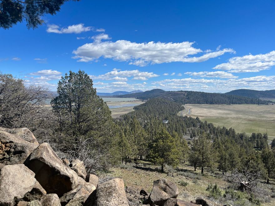 Oversized, almost an acre,  View Lot at the Running Y!  The eastern ridge at the Running Y boasts some of  the most dramatic views, with sunrise, lake, mountains and ranch lands.  Sunset can be right out your front door!