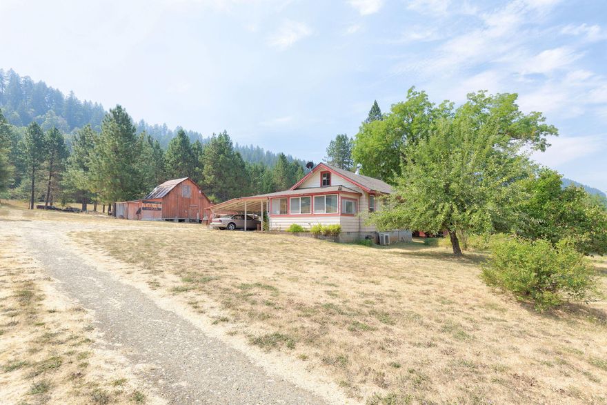 Country living at its finest! off the beaten path but still close enough to either Grants pass or Roseburg for major stores! upgraded older home featuring 2 bedroom 2 baths. Comfortable in both summer and winter with efficient Ductless heat pumps even in the huge shop! Oil heater back up in the home while the shop has propane heat as well. fruit trees include a huge black walnut, apple and plum. 11 acres is enough to ''stretch out''. lots of firs, Pines and cedars through out the gentle sloping hill that runs up behind the leveled areas the barn, shop and house sit on. updated features include newer appliances and water heater. a cozy older home perfect for getting away from it all and giant car shop to tinker in. Rustic barn for storage and plenty of room for RV parking. An older single wide converted to a work area is immaculate inside as a former upholstery area. Lots of space for livestock / horses. Covered parking. the gated drive keeps solicitors to a minimum. Wont last call today