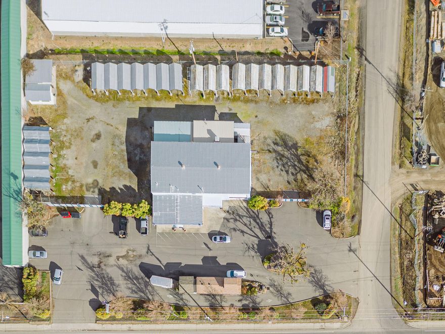 Unique opportunity to own a 6400 sq ft Steel Building with Offices, an attached Shop and a Drive through food/beverage building on a 1.42 acre lot. Zoned General Industrial on a busy street, the possibilities for this property are endless. The main building was previously used as a medical equipment engineering facility and had many upgrades done to accommodate the use. The main level includes a Show room/Reception area with a Restroom for the public, an Office, private Restroom, several large storage and building rooms, and a heated 40'x40' Shop with 3 Phase electrical and Roll up doors. Upstairs are 5 Offices, a Conference room, Restroom and more Storage. Out back is a painting booth, sand blasting building, Steam generator and air compressor hookups, Fenced and gated storage/parking yard with 23 metal carports. The drive through restaurant has long term tenants in place. It includes heating and air conditioning, a storage room, a restroom, and a gazebo to enjoy the food.