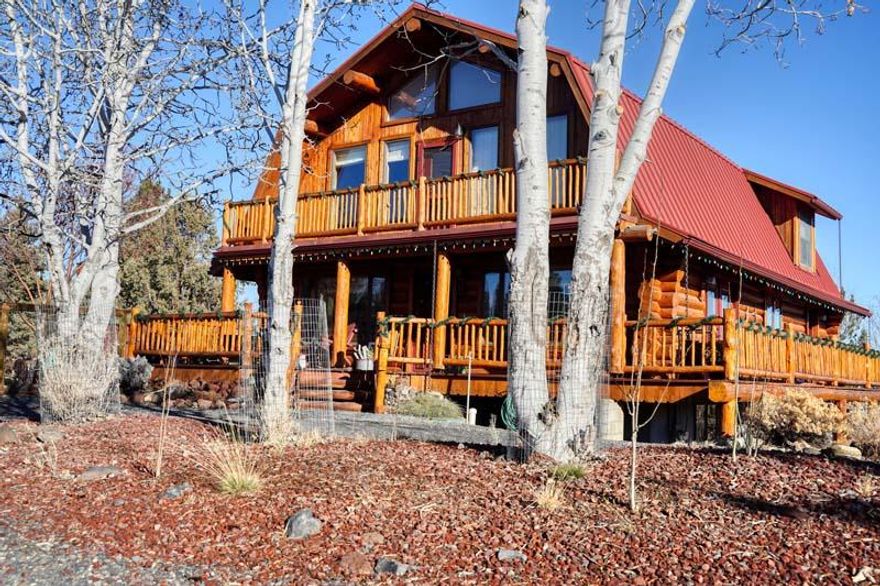 Serenity awaits you when you own this wonderful log home on over an acre. Main floor master, 2 upstairs bedrooms, loft, and full suite in the basement with secondary entrance & kitchenette. Good view of the North Sister from the second floor family room. New:  flooring, carpet upstairs, flooring downstairs, oven, dishwasher, 2020 heat pump, paint inside, accent walls downstairs, new tiled shower, vanity downstairs bath, built in Murphy bed, new mini fridge and sink. New lighting. Outside landscaping front and back, sprinklers and drip on timers. Logs striped, stained, chinked and sealed. New back deck and pavers, rain chains and gutters. Spa hot tub. RV/parking access and gazebo. Great access to public land for forested solitude.  Located between Bend and Sisters makes this home location perfect.