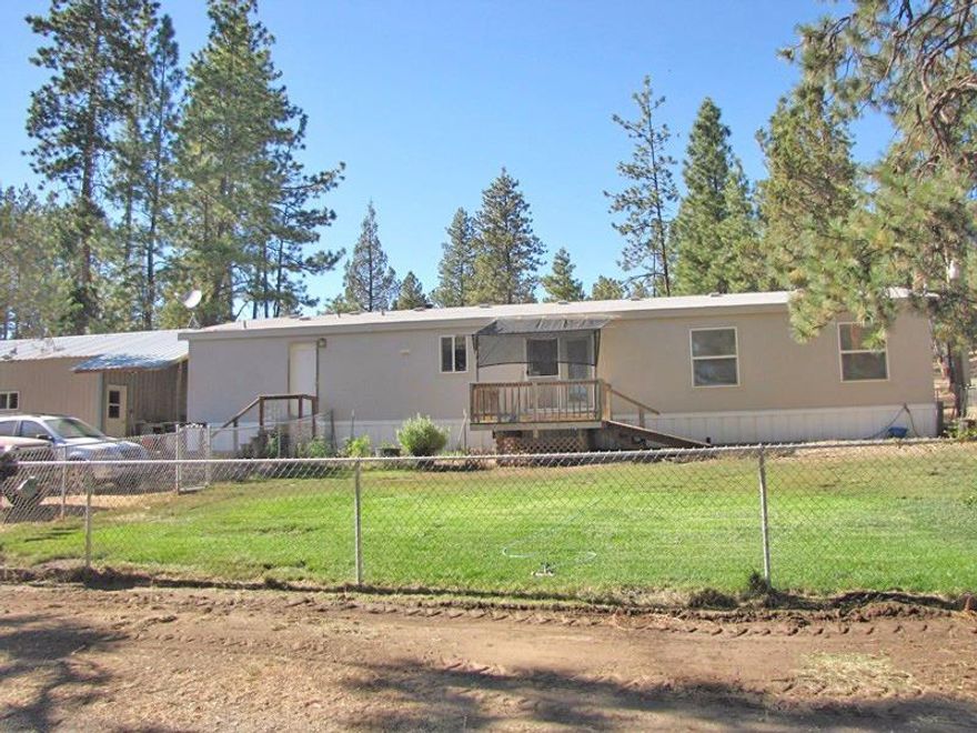 This very desirable horse ranch on over 15 acres with an easy drive town. 1848 SQ FT, 2000 MFH with 3 bedrooms, 2 baths in like new condition includes two additional rooms for an office and craft room. Spacious breezeway connects to a 40' X 24' garage shop. Fenced pasture with small pond and 40' X 24' pole barn. Conventional and wood heat. Additional buildings include wood storage and tack barn. This is a beautiful complete horse property that will provide solitude, comfort and access to many horse trails, all in a beautiful forested setting.