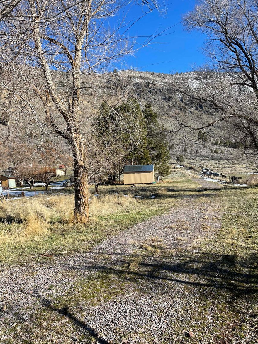 This hard to find 1.48-acre lot has a newer well and septic and an electric meter on the property. Also, included is a gravel driveway that leads to a 10X20 shed. It is located in a nice neighborhood with beautiful views of the mountains. Don't miss out, build your dream house or place a manufactured home on the land. Buyer to do their due diligence on building, permits etc.
