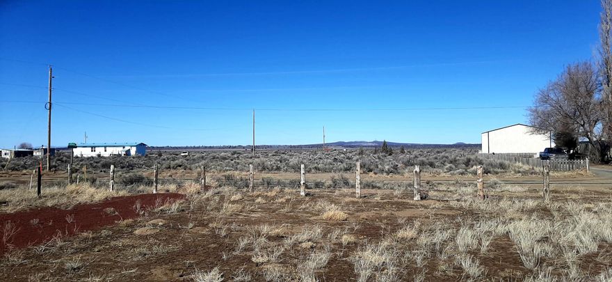 Scenic residential lot with septic feasibility done. This spacious residential lot offers a great foundation for your future home. Already cleared and fenced, situated on approximately 1/3 of an acre. The property features distant mountain views and a peaceful setting perfect for those looking to enjoy the beauty of the high desert. Conveniently located close to town, you'll have easy access to restaurants, grocery store, a clinic, credit union, and a hardware store.  Whether you are planning to build a dream home, or create a getaway, this lot offers excellent potential! Your recreation paradise awaits!  Buyer to do own diligence.The Recreation District is comprised of:  Baert Lake, a 9 Hole Golf Course, Rodeo Grounds, Community Hall, Airport, and a Multipurpose Field.