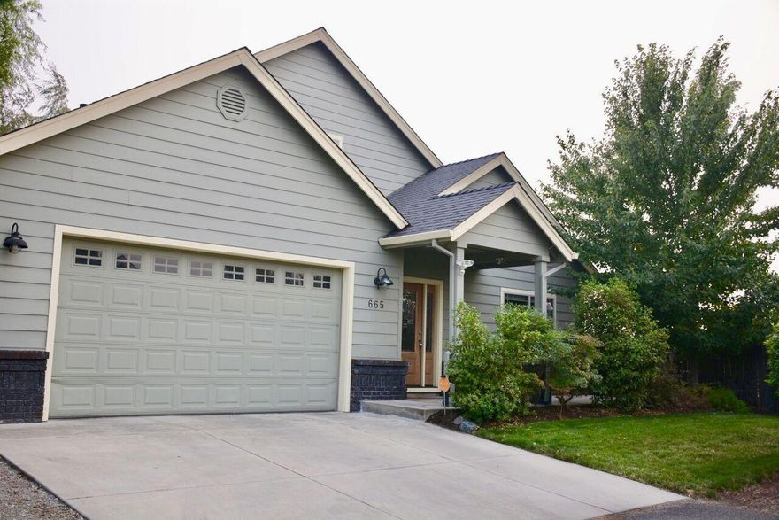 This immaculate home sits on a flag lot with a low maintenance backyard. The covered back patio offers views overlooking mountains and the neighboring orchard. Enjoy the open floor plan with a main floor master, 2 bedrooms, living room and beautiful kitchen. The kitchen includes cultured marble, tile and granite. All kitchen appliances included! Upstairs features an additional bedroom, bathroom and a family room.