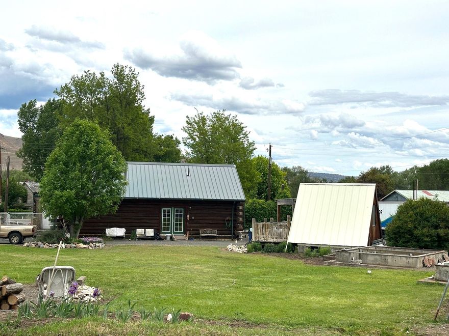 Live & Work From Home! Entrepreneurs listen up. 3 bedroom 2 bath home 1694 Sq/ft loghome sets on 0.69 of an acre lot. Built in 2005, sauna, 2 level,  city water, sewer, well and irrigation ditch.  This property also offers an A frame cabin plus an additional 7 poured concrete foundation with power just waiting for you to build out cabins for rental income. An additional 3 foundations are formed up. 3 RV dumps (1 with power, water & sewer). Dayville, Or is located near the Fossil Beds, Painted Hills, Malhuer & Ochoco National Forest.  Access to thousands of acres of public land, horseback riding, cross country skiing, hiking, camping, hunting, snowmobiling, ATV's and more. This area is a destination for tourism.  Contact Dayville City Hall to find out how you can make this property into whatever your vision might be.