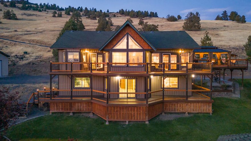 Discover this remarkable 3,400 sq ft residence, featuring four bedrooms and four bathrooms across two spacious levels, each equipped with a kitchen for versatile living. The home is designed for comfort and convenience, with heated floors in the upstairs kitchen, and primary bathroom, ensuring a warm welcome year-round.

Step outside to enjoy the brand new composite decking that wraps around both the upper and lower levels, providing ample space for relaxation and entertaining while soaking in the scenic surroundings. The property includes a fully insulated 24x36 shop with 220, perfect for hobbies and projects.

Recent upgrades include a brand new heat pump and well pump (installed in 2022), enhancing the home's efficiency and reliability. Plus, the added RV dump makes this property a dream for outdoor enthusiasts.

With elegant granite countertops in the kitchen and a beautiful, functional layout, this home is a must see!!