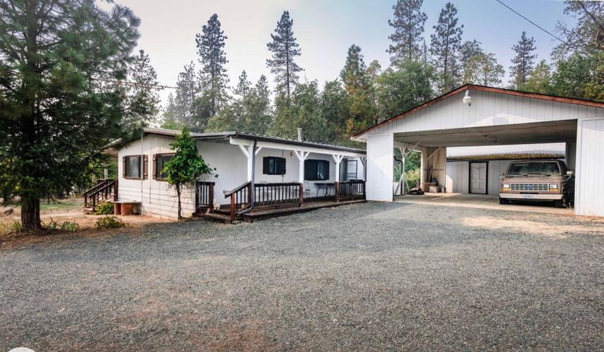 Comfortable Mobile on Over THREE Acres. Clean, Livable, pretty well taken care of property in Family for decades. Can use deferment maintenance and TLC.  NICE Big non enclosed Garage/Carport , Workshop and shed. Great Location with 2 tax lots.
 Home sold 'AS IS .'' Fully Furnished including towels and dishes. Ultimate situation to live in and /or Build new home.