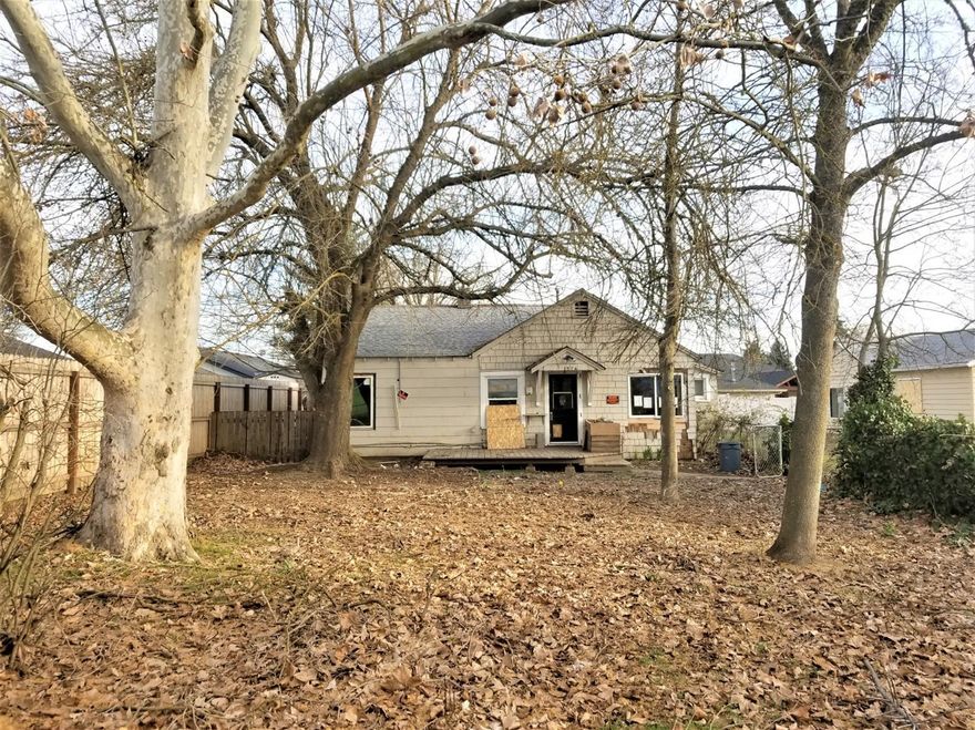 Tons of potential! Large .43 acre property zoned R-1-6. The main home is a considerable fixer upper or tear down as it's nearly 100 years old. The detached garage/shop was built in the 1990s and is plumbed with a bathroom and has 200 amp service. This structure has been permitted. Consider building your dream home with the convenience of a large workshop area!