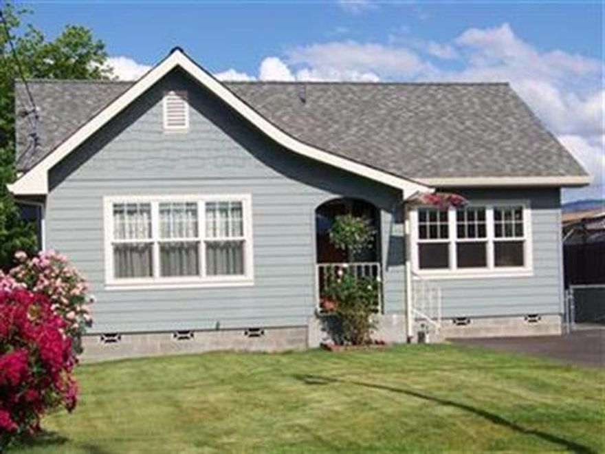 This adorable home features hardwood floors, new energy efficient windows, newer roof, high efficiency dual fuel HVAC system, brand new front sprinkler system, custom energy efficient window coverings, RV parking & a 400 sq.ft. detached studio/shop building and all new siding. This charming home has a formal dining room w/original built-ins and leaded glass window. An original charming alcove in hall and upgraded bathroom fixtures. The fully fenced rear yard has a patio perfect for entertaining.