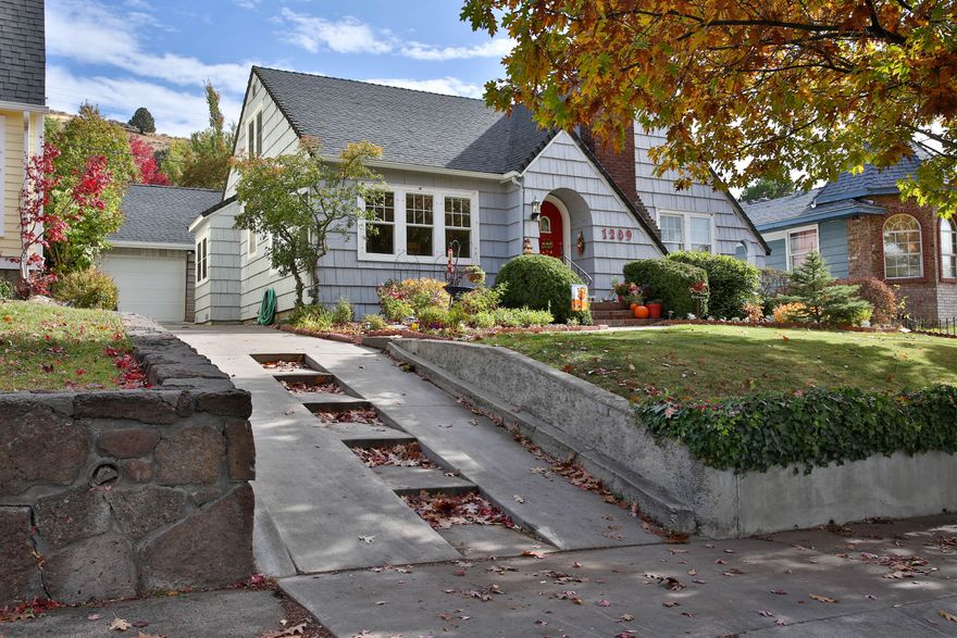 Welcome to this charming geothermal home in the desirable Hot Springs neighborhood! The large living room features a cozy wood burning fireplace, open to the bright and airy formal dining room. The kitchen has tile counters/backsplashes, many updates, and an open breakfast nook. An office/reading area sits off the breakfast nook with sliders leading out to the covered paver patio in back. Beautiful hardwood and tile floors run throughout the house. The large primary bedroom has a sizable walk-in closet. An unfinished 700 sq ft dry basement has windows, workshop space, utility area and updated plumbing. All appliances are included. Newer detached 1 ½ car garage conveniently sits close to the house.  The beautiful backyard showcases many specialty fruit trees, peonies, roses, and other perennials. Recently permitted upgrades were done to the electrical and sewer system in the house. Schedule your showing today.