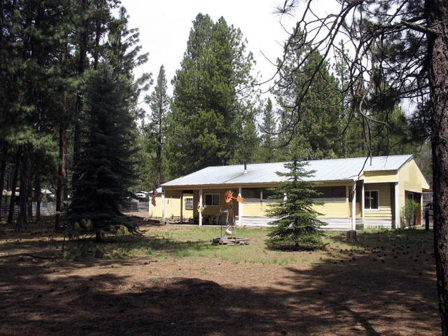 This nicely treed property consists of a 1977 2 bed/2 bath manufactured home on approx 1.02 acres. All vinly flooring throughout the home. Home has been protected underneath a pole barn with a metal roof its whole life. Property has lots of storage, a detached garage, wood shop, studio, pump house, green house and more. Double pane windows. Deeded access To the famous Williamson River. Property is well priced.