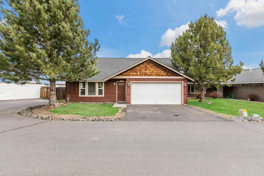 Enjoy this large open and bright 5 bedroom, 2 bath home. Nice neighborhood at the end of quiet street with elementary school next door. Wonderful open concept living with new interior paint, carpet and new A/C unit. Primary bedroom and laundry located on the main level. Enjoy the warmth of the gas fireplace and beautiful view from kitchen and backyard. Don't miss out on this fantastic home close to all amenities of Madras and Central Oregon outdoors!