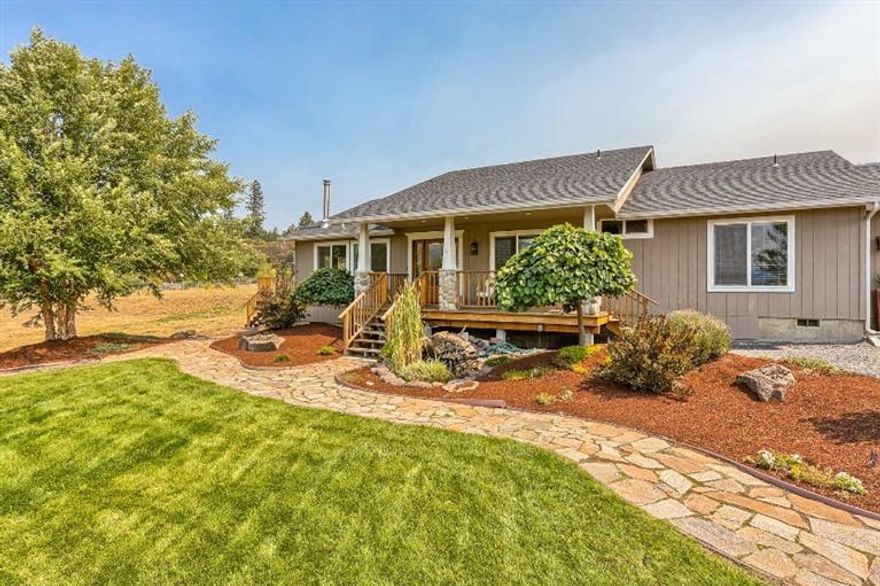 Come & view this lovely home on 1.57 acres w/amazing views & high quality upgrades throughout. Beautiful flagstone pathway leads up to the gorgeous solid front door w/sidelights & specialty glass. Inside upgrades include hand-scraped hardwood flooring in main living area & master; vaulted ceilings & open concept between Great room & kitchen. Great room has French doors & a wood stove to keep you warm on cold winter evenings.Remodeled kitchen features custom solid wood cabinets, polished Calacatta marble counters, cast iron apron front sink, subway tile backsplash, stainless steel appliances, pantry w/roll out shelves, built-in desk & huge island w/tons of storage! There are tranquil views from every window. Master suite sports a walk-in closet w/wood custom closet pack, soaking tub, double vanity & tile flooring. Guest bedrooms are light & bright w/new carpet, closet packs w/drawers & pottery barn chandeliers. Guest bath has new Pottery Barn vanity & light fixture. Multiple lots.