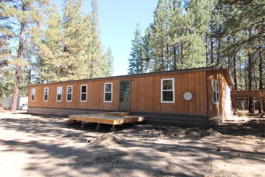 If you are looking for plenty of privacy with peaceful views of the large pines,then this is the place for you. Very well cared for home on 20 acres. Set back from the main road to offer very much needed quite. Two horse out buildings with water and power. Some electric fencing and some cross fencing. Just needs a good imagination and the possibilities are endless.