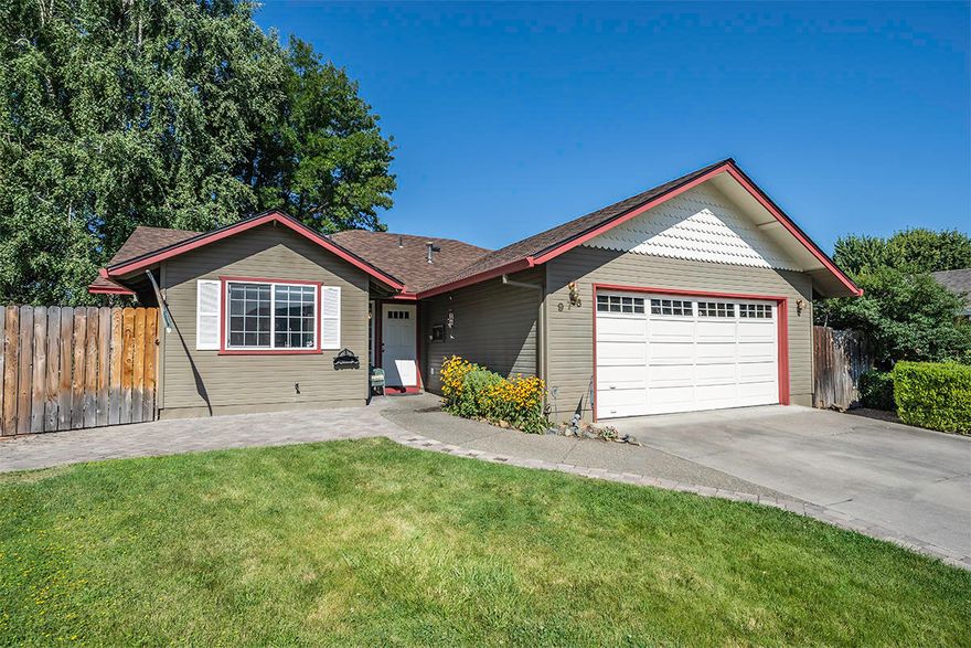 Beautiful single-level home in established cul-de-sac neighborhood with vaulted open-concept dining and living room which open to a tranquil backyard oasis. Covered patio and deck, grass lawns, mature landscaping, garden beds, and covered hot tub area accessed via french doors from spacious master with walk-in closet and en-suite bath. Two additional bedrooms and full bath with skylight and tub/shower combo. Efficient kitchen layout with solid surface counters, eating bar, dishwasher, refrigerator, and range oven. Other amenities include a tiled entry, laminate plank flooring, ceiling fan, laundry room, two-car garage, and nice backyard storage shed.