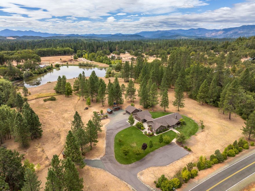 Welcome to 255 Mountain Paradise in the highly desired Paradise Valley Estates of Hugo, Oregon. This single-level 2,356 sq ft home sits on 5.01 flat, usable acres & is being offered for the first time. Featuring 3 bedrooms, 2 bathrooms, 9 ft ceilings, & a 13 ft vaulted living room, the home is finished with hickory floors, alder cabinets, & solid-core 3 ft doors with 4 ft hallways. The spacious primary ensuite includes two walk-in closets, privacy insulation, & a granite shower. Two detached garages provide parking for five vehicles or shop space. Enjoy the fenced garden with garden house, chicken coop, RV parking with power & water, plus a Generac 22kw Home Generator. With a large covered patio for outdoor living. Constructed with 2'6'' walls and blown insulation, the home is designed for comfort & efficiency. A strong well ensures reliable water. This property offers the perfect blend of function, beauty, and lifestyle—truly the Oregon Dream.  Call for your private tour today!