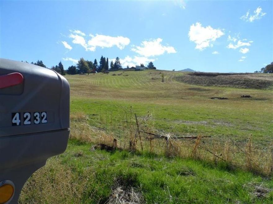 Potential 2 family set-up on these two 5 acre residential parcels. Well is in at 15 gpm, power is at the road, and the views are fantastic. The upper lot boasts of views for almost 360 degrees with a nearly level home site on hilltop knoll and the driveway is in. The lower lot fronts on Pioneer Road and has room for animals of many kinds (probably not elephants) along with a great home site. The well is capable of serving both lots. Lots will not be sold separately.