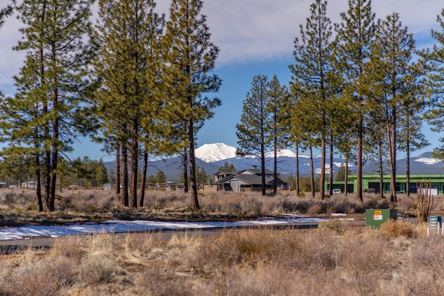 Nestled in a quiet cul-de-sac within Bend's notable Westgate neighborhood, this 2.5-acre lot boasts a nearly level build site, mature and towering ponderosas, and iconic Central Oregon views in all directions. This property sits perched above most of the surrounding terrain and will offer the ability to create a sense of privacy while also allowing expansive vistas of the surrounding landscape, including a number of buttes and mountains. Westgate's location is perfect for those who love the outdoors, with nearby Shevlin Park and access to thousands of acres of public lands being within walking distance. This neighborhood also puts you just a short bike ride or drive away from some of west Bend's most loved shops, dining, and entertainment. Seize this exceptional chance to build your dream home on a unique lot within Westgate, where luxury meets nature.