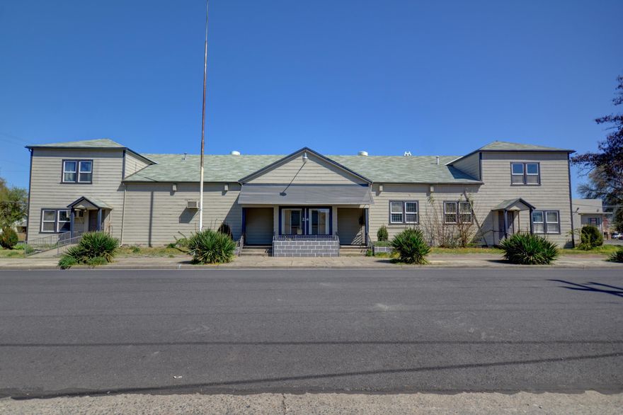 Great investment opportunity for any buyer with a vision! One completed vacation rental or rental unit with the potential of at least 2 more. Main floor kitchen, multiple bathroom stalls, stage, dance floor, office space and plenty of communal space. Original hardwood floors. Served as the Grants Pass Community Center as for several years. See the attached plans in the documents tab. Could be an amazing AirBnB or community space.Live in part and run your business in the rest. 

Mixed zone allows multiple uses from residential to commercial. 

Disclosure: Buyer to do their own diligence, purchase as-is where is.