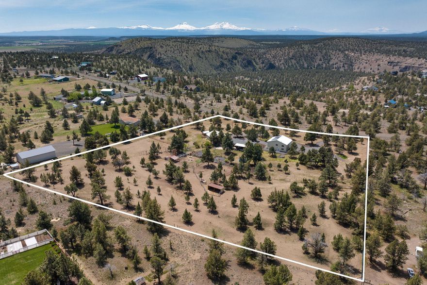 Welcome to your own private Central Oregon paradise—where space and adventure come standard. This property has been beautifully updated with brand-newflooring throughout, 24 new can lights, and a new dishwasher. The property features two massive 40x36 outbuildings, offering endless options for projects, hobbies, or storage. The RVpull-through includes a fully permitted 640 sq ft guest house, complete with a 4th bedroom and 3rd bathroom. Upstairs, you'll find a versatile 640 sq ft loft/bonus room with its own A/C—ideal for guests, a creative studio, or extended living. Plus, the property is equipped with solar power to reduce your energy costs. Step outside to enjoy the fire pit, a greenhouse for year-round gardening, and a chicken coop for fresh eggs. This is more than a home—it's a lifestyle that combines rural charm with modern comforts and plenty of room to dream big.