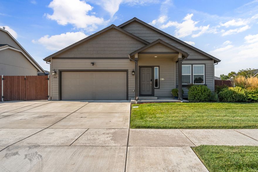 Single-level stunner on a corner lot with rare upgrades you won't find in the Hayden ''Hudson'' plans—this one features a covered patio and a private slider + patio off the primary suite, premier corner lot and extra deep garage! Built in 2017, this home offers 3 beds, 2 baths, and 1,579 SF of smart, stylish living. The open-concept great room showcases hardwood floors, a gas fireplace, and a kitchen with quartz counters and stainless appliances. Outside? You'll love the fully fenced yard and 40' concrete RV pad with 30 amp service behind the gate—room for your toys without sacrificing curb appeal. Primary suite offers dual vanities, a walk-in closet, and direct access to your own private covered patio retreat with gas bbq hookup. Close to shopping, parks, and trails in Delta Estates. This home is clean, modern, and move-in ready!