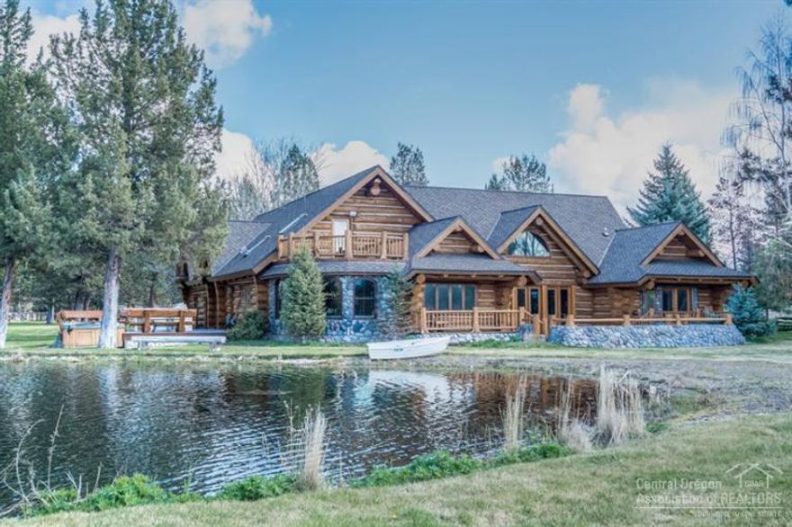 Spectacular 21+ acre gated estate with two log homes, each with barn, pond & separate guest accommodations. Both homes feature massive logs, gourmet kitchens, paved driveways & panoramic mountain views over beautiful ponds. Five pastures, with underground irrigation, 40x20 hewn timber barn, which can store an RV, with hay loft/storage above; second barn includes finished horse stalls with turnouts & large shop area. Contact agent for complete list of home and property features. By appointment only.