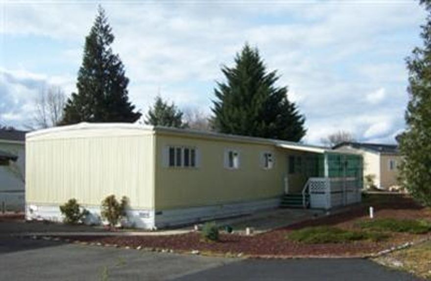 1970 1080 Sq. Ft. Manufactured home in Rogue Lea Estates, Grants Pass's premier +55 park, located 2 miles out of town along the Rogue River. Priced to sell fast this home has a new roof, new exterior paint, new under-seal, new double pane vinyl windows, new exterior skirting vents, new thermostat, new electrical panel, with breakers. Central air conditioning is 1 year old. Custom vertical blinds on most windows. Bathrooms are partially handicap ready. Forced air natural gas heater. Comes with Refrigerator, Washer and Dryer, gas stove/oven. Motivated seller will look at all offers.