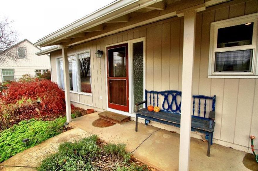 Welcome home to this adorable North Main home set on a large, sunny lot (.21 acres) offering spectacular views of Grizzly Peak and the valley. This and its location on a quiet street are just some of the qualities of this lovely hard to find Ashland property. 3 bedrooms, 1 bath, living room with big windows looking out at a fantastic view. The rear yard has a deck perfect for entertaining with steps up to an additional building w/bath & electricity which would make an amazing artist studio, home office or additional sleeping space. The views from this detached building arc amazing. Home has a newer hot water heater, updated windows, cozy kitchen w/ gas stove, plenty of cupboard & storage space. The garage w/laundry has plenty of additional storage space in attic. Ashland schools w/ easy access to I-5 and Hwy 99. A rare find in beautiful Ashland, Oregon!