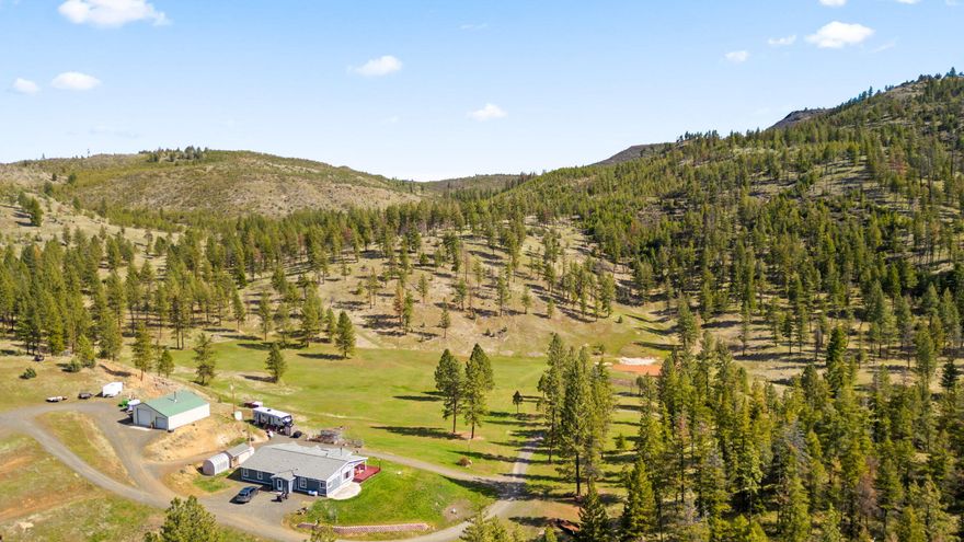 Priced to Sell!!! $10K credit towards flooring/paint or buyer can use towards their closing costs. Welcome to your slice of heaven situated on 40+ acres of a park-like setting. This incredible property has abundant deer, elk, and wildlife roaming freely amongst the
towering pines. Sit by your private pond and enjoy a picnic or BBQ and enjoy Alder Creek as it meanders through over half a mile of the property filled w/multiple species
of fish. There is a 4-bedroom, 2.5-bath 2,640 sq ft home with a newer heat pump & blaze king woodstove, providing efficient heating throughout winter. Detached 1,296 sq
ft shop w/built in work benches, 220v power, & concrete floors. Full RV hook ups w/30 & 50 amp service. Don't miss the opportunity to make this retreat your own and
experience the unparalleled beauty of Central OR. LOP tags, check with FS for more info.