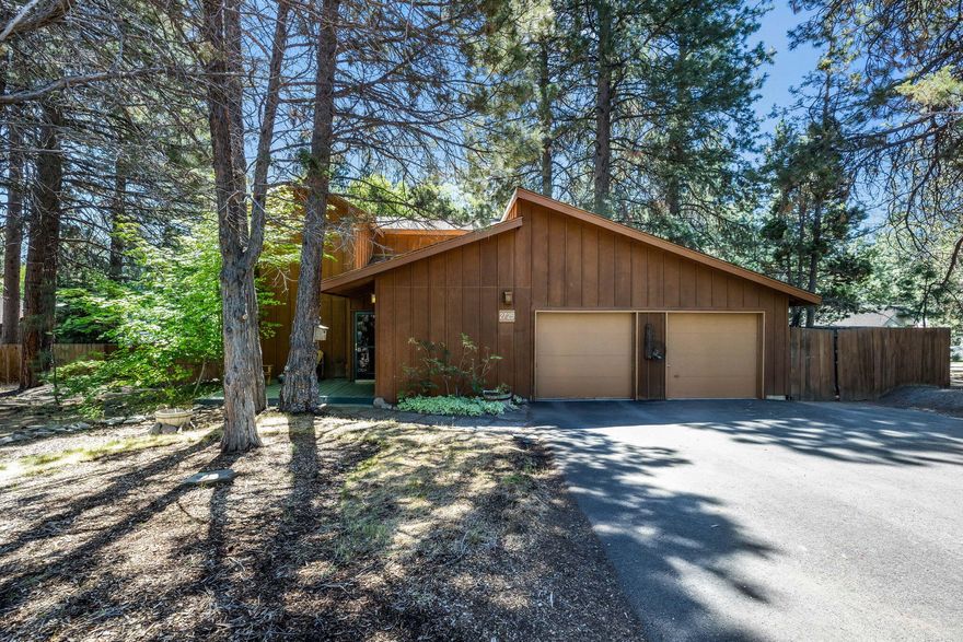 This charming 3-bedroom, 2-bath home offers a unique blend of rustic appeal and modern potential. Nestled on Bend's desirable west side deep in the forested neighborhood of Valhalla, the property features a spacious .35-acre lot with ample opportunities for RV parking or a potential ADU addition. The home is filled with unique character, with 2 bedrooms upstairs and 1 on the main level all highlighted by natural wood grain beams and rails throughout.  A passive solar living room with tall windows for collecting southern facing sunshine and aggregate concrete for warming in the winter. The backyard features a secret garden that could be the envy of the neighborhood. With ample space and endless opportunities for customization, this property is a rare find in a prime location. Seize the chance to create your dream home or investment in this quiet and peaceful, tree-lined community.