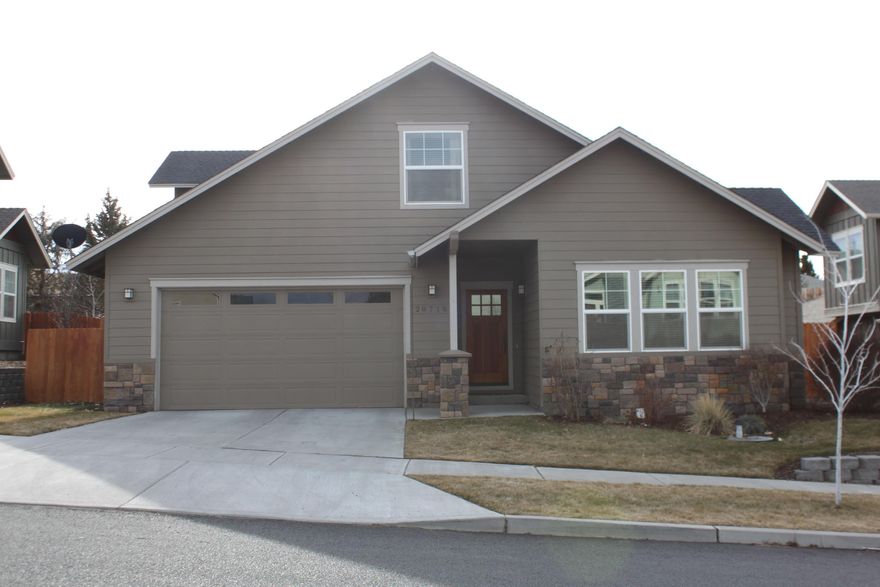 Beautiful home with open kitchen to eating area, dining room and grandroom with gas fireplace. Brazilian cherry wood floors, with wainscot and crown molding, The Kitchen is granite with a breakfast bar island. The home is a 3 bedroom with Master on main and 2.5 bathrooms. A large family room upstairs could be an office, bonus room, extra living space or 4th bedroom if needed. The home has air-conditioning, with a fenced back yard. Great home in a wonderful neighborhood.