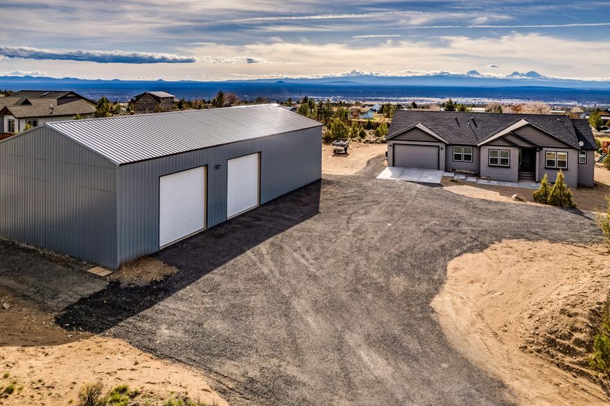 Newly built (2022) NW Traditional with GIANT Mountain Views situated on 2.39 acres boasting a massive 36x70 shop! This light and bright home features an open and flowing floor plan. The kitchen includes quartz counters, stainless appliances & pantry.  The living room includes a gas fireplace with mantel, vaulted ceilings and views of the Cascade Range. The spacious primary bedroom has vaulted ceilings, walk-in closet, bathroom with double vanity, tub & shower. The home also has a 3 car attached garage. The shop is just over 2500 sqft with 12x12 doors and is equipped with full electrical. Plenty of room for RV parking & more.