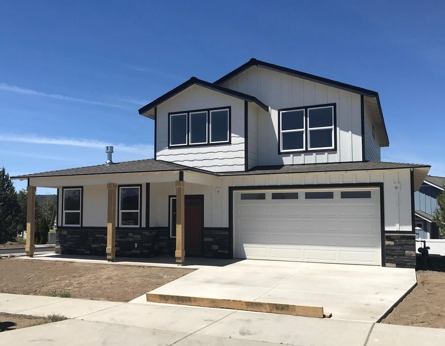 This new home built by Ross Built Homes, LLC  in NE Bend features a main level master suite and is close to medical, restaurants and shopping. Noteable features include a gourmet kitchen with quartz counter tops, stainless steel appliances and a gas fireplace with rock surround in the great room. The luxurious master suite is complete with ceiling fan, full tile shower, double vanities and a generous closet. Upstairs you will find 2 bedrooms and an open bonus room with a linen closet and an oversized walk in closet.