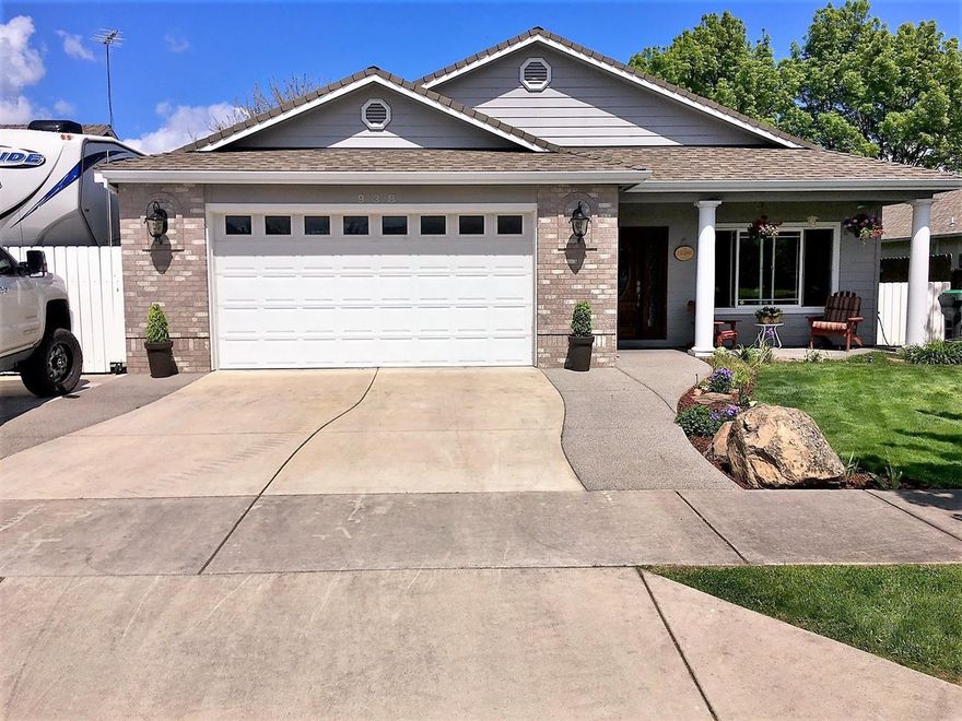 Totally Custom-Built 1-Owner Home - Built by Rick DeAscentis Construction ('03) in Hampton Place. This home has a very open floor plan with tall 9-ft. ceilings throughout, making it light & bright. Featuring so many upgrades to list. Some include: wood baseboards throughout, wood wrapped windows, vaulted & coffered ceilings, plant shelves, XL 585 sq. ft. 2-car attached/finished garage with built-in work bench & storage, utility sink + pull-down ladder w/extra storage above, 90% efficient gas heat, walk-in closet, covered back/front patios, granite countertops, stainless steel appliances, tons of slate & tile flooring & upgraded lighting/plumbing fixtures, upgraded carpet & much more! Nice area, minutes of Downtown, Central Point & Jacksonville. Landscaped front & back yards w/timed sprinklers + completely fenced back yard. Stamped concrete in back yard leads you to the Trex deck surrounding the hot tub, included in the sale + huge concrete RV parking w/full hook-ups.