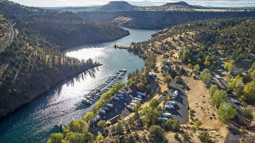 Destination RV park w/77 full hook up RV spaces at Lake Simtustus - located north of the Round Butte Dam from Lake Billy Chinook. 55.5 Acres w/room for expansion. Well maintained, turn key facility includes owner's residence store/office, laundromat. Most spaces are reserved in advance. Facility is open year round w/excellent cash flow. The only private property w/lake access on this 640 acre, 8 mile long lake. Includes 49 slip boat dock, boat ramp, 2 bath houses, boat & board rental & 3 rental trailers.