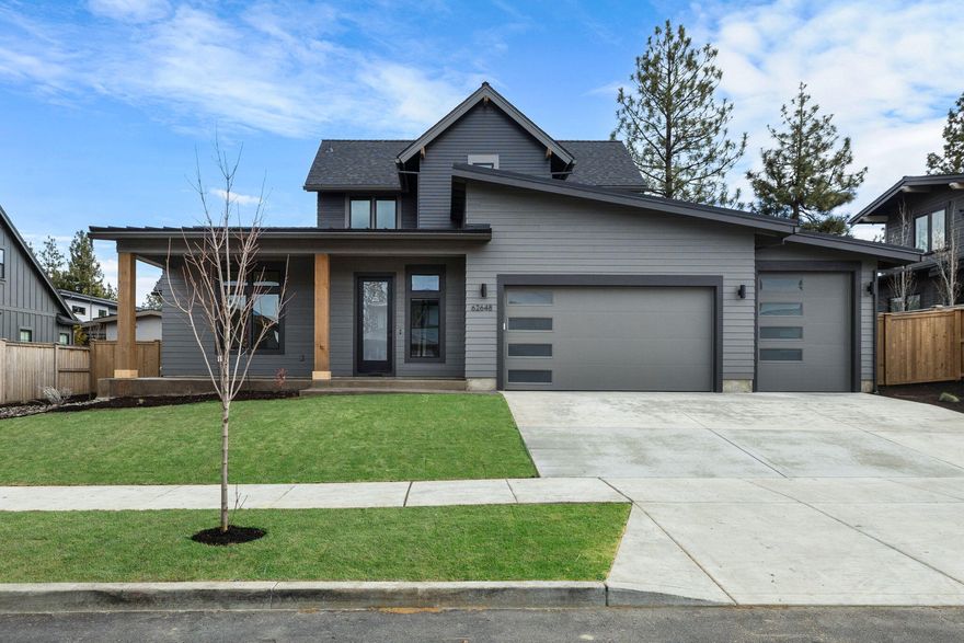 Welcome to another stunning NW contemporary home by Bruce Wiechert Custom Homes, Inc., in the desirable Shevlin West neighborhood. Situated on a quiet cul-de-sac, this meticulously designed home offers modern luxury and thoughtful craftsmanship. An open floor plan seamlessly blends elegance and comfort, enhanced by vaulted ceilings, exposed wood beams, and rich wood flooring. The gourmet kitchen boasts custom rift oak cabinetry, a waterfall quartz island, and premium stainless steel appliances. Expansive windows fill the home with natural light, showcasing breathtaking panoramic Cascade Mountain views. With four spacious bedrooms, a versatile bonus room, and a 3-car garage, this home is designed for exceptional living. Outside, enjoy multiple entertainment spaces, lush landscaping, and a fenced level lot—perfect for relaxation or gatherings. Experience the best of Central Oregon living in this beautifully crafted home.