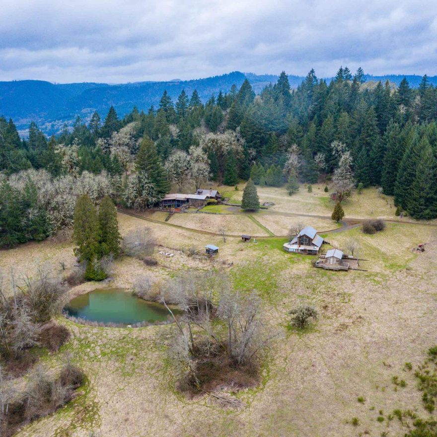 Legendary 367-acre estate hidden in Oregon's wine country is now available. Once home to an intentional community that included Steve Jobs, the All One Farm holds multiple houses & an apple orchard. The main home is defined by rustic craftsmanship & panoramic views of serene natural grandeur. Well-managed forests offer over 4 million board ft of merchantable lumber and even more value for those with the vision to steward and safeguard these sacred woods & the once-in-a-lifetime property they enshroud.