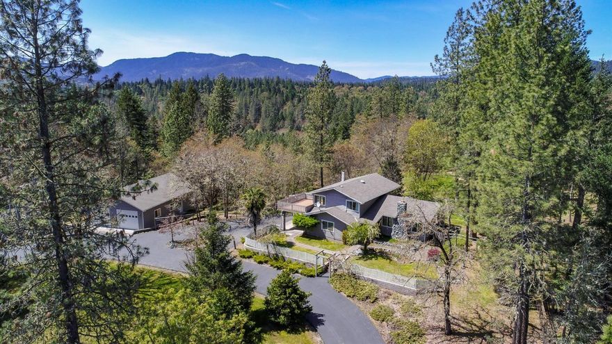 This is a must see property! A beautiful split level, 3 Bdrm/3 Full Bath home on 2.56 acres in a great neighborhood. Formal living room with a fireplace, dining area in Kitchen and a formal dining room. A family room with large windows to view the landscaped back yard. In this home you will find hardwood floors, tile and carpet. Abundant space in this home. Also a large laundry/utility room with a large pantry/storage area with shelving. This property also features two detached garages. One is 35x48 with a hydraulic lift for that person that likes to work on or build cars. It also has a large air compressor. This garage alone can hold 4 vehicles and still have room to work. It has two 220V outlets and is wired for sound. The other detached 2 car garage has a workshop area also. All garages have automatic door openers. There is also a large fenced garden area with fruit trees. Automatic sprinkler system covers all the landscaped areas. There is a lot to see with this property!