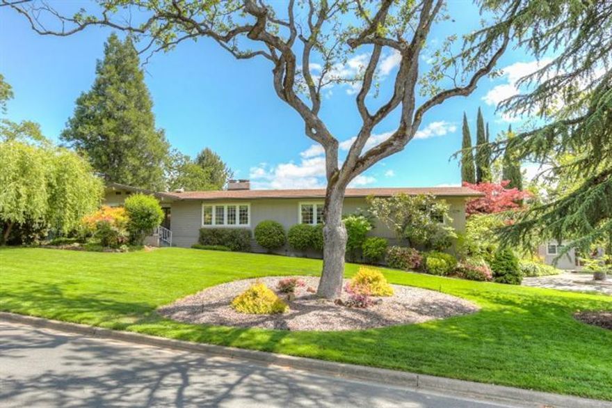 Wonderful East Medford Charmer! Beautifully upgraded, light & bright single story home has 3 bedrms, 2.5 baths, 2831 sq ft w/private backyard. Nice hardwood floors, crown molding, recessed lighting, newer vinyl windows w/hide away screens, Hunter Douglas blinds, skylights, custom storage, formal living & dining rooms w/gas fireplace & glass front cabinets, large family rm w/coffered ceiling. The spacious master suite has French doors to the back patio, his & her walk in closet, double sinks, jetted tub & separate shower. Two more bedrms, one an ensuite. Kitchen features tile counters & backsplash, eating bar, dbl ovens, gas cook top, dbl drawer dishwasher open to a 2nd dining room w/gas fireplace & French doors to back patio. The backyard has outdoor kitchen, 2 burner cooktop, refrigerator, sink, covered patio, gazebo, fenced in salt water pool w/solar panels & deck area for lounging. Yard lighting, mature oak trees, separate shop/exercise room. All on a large .43 acre lot.
