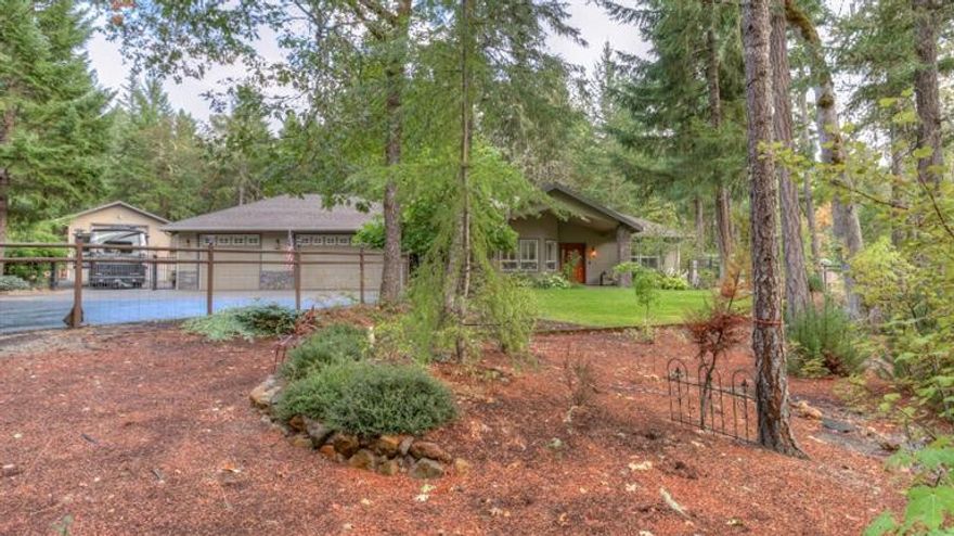 Absolutely stunning Chapman built home available now in the upscale Indian Ridge subdivision. Serenity among the trees can be found on this quiet cul-de-sac where you have your own park-like manicured 2.5 acres. 3 beds, 2.5 baths, open family area and split floor plan. Granite counters, custom lighting, fine cabinetry and high end appliances. Master bathroom features jetted tub, cultured marble and separate shower. Large 3 car attached garage, Extra Deep detached 46x20 RV garage and 16x30 media room and guest quarters with separate heatpump. 1 acre of manicured landscaping...the rest is wooded. Home Warranty Included.