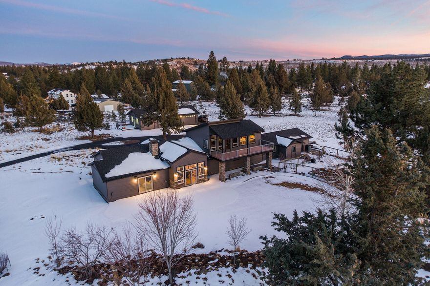 Stunning home in Sundance located on a beautiful 3.08-acre corner lot. The meticulous attention to detail, craftmanship and high-end finishes compliment every inch of this home. There is extensive use of wood throughout including floors, trim, doors, cabinets, accent beams and built-ins. The gourmet kitchen features a chef's gas cooktop, double ovens, double sinks, built-in fridge, island and granite & concrete countertops. An open floor plan makes this home an entertainer's delight, with most of the homes' 2952 sf of living on the main level. The primary bdrm is on the main level and features his & her's closets along with a large bath with dual vanities, large tile shower and soaker tub. There are two more guest bedrooms downstairs. The second primary bdrm is upstairs along with the bonus room w/ a vaulted ceiling and private balcony. There is a 4-car attached garage plus the detached garage/shop with a large separate workspace (heated). Beautiful landscaping, pavers and garden area!